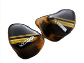 SoftEars Cerberus In Ear Monitors, a pair of black and gold-striped IEMs with the brand name 'SoftEars' visible on both units.